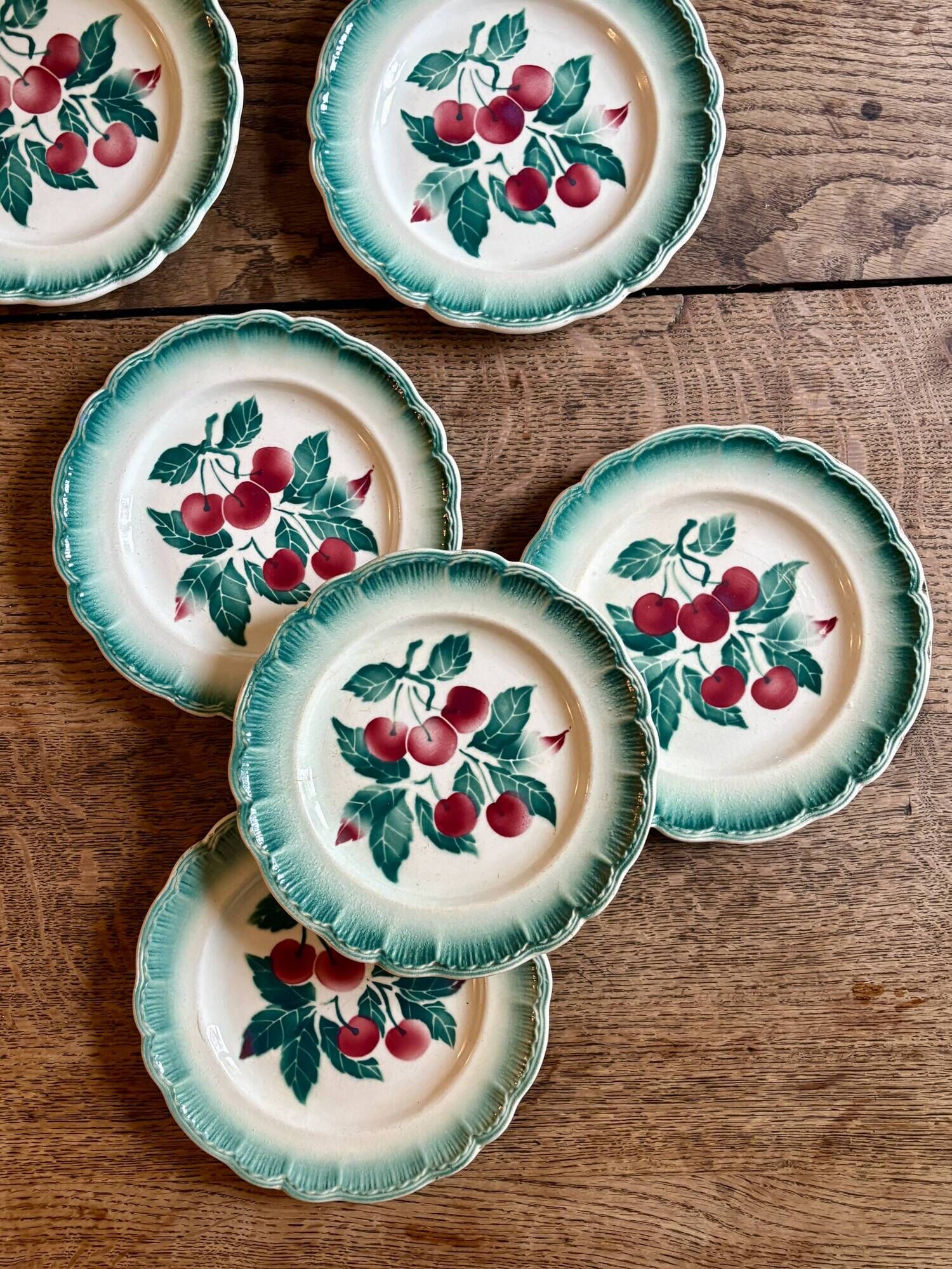 Set of 7 vintage Badonvilier dessert plates.