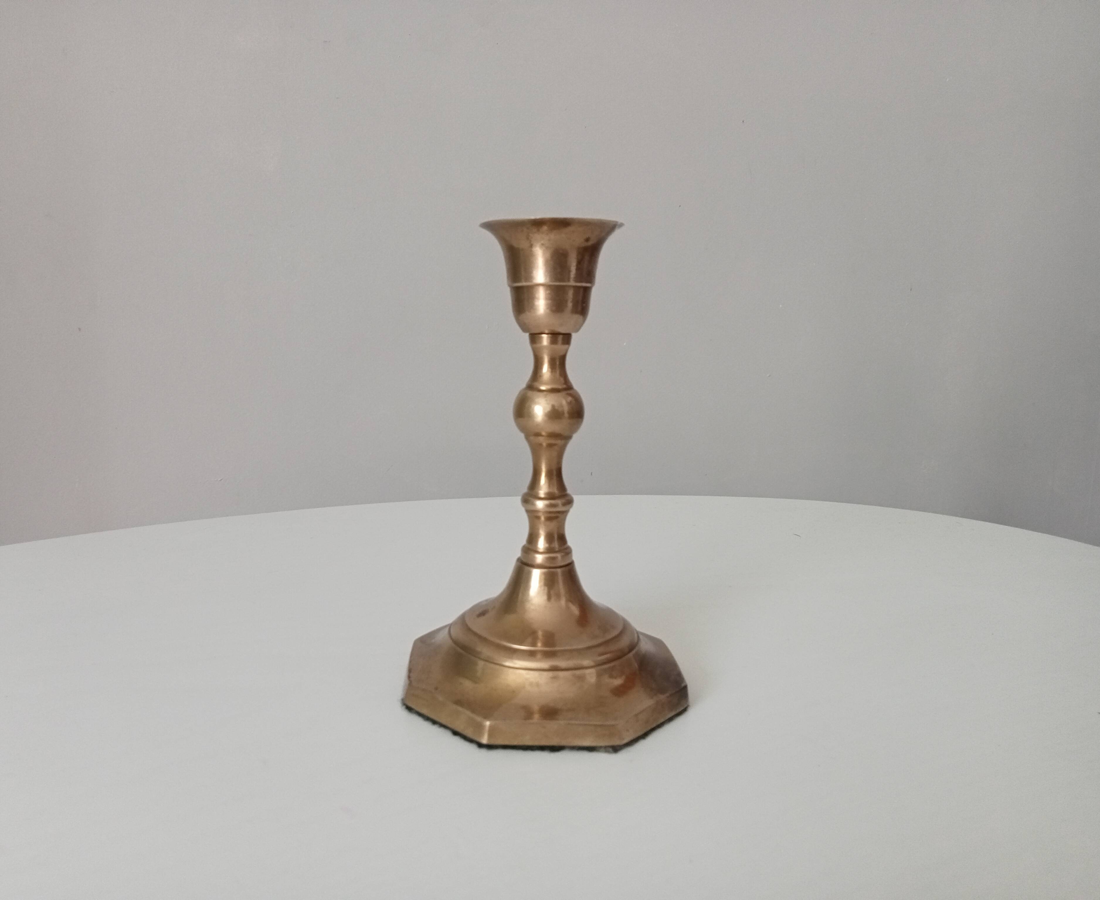 Antique candle holder in solid brass