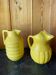 2 old lemon yellow jugs