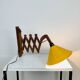 Scandinavian accordion wall light from the 60s, wood and yellow reflector