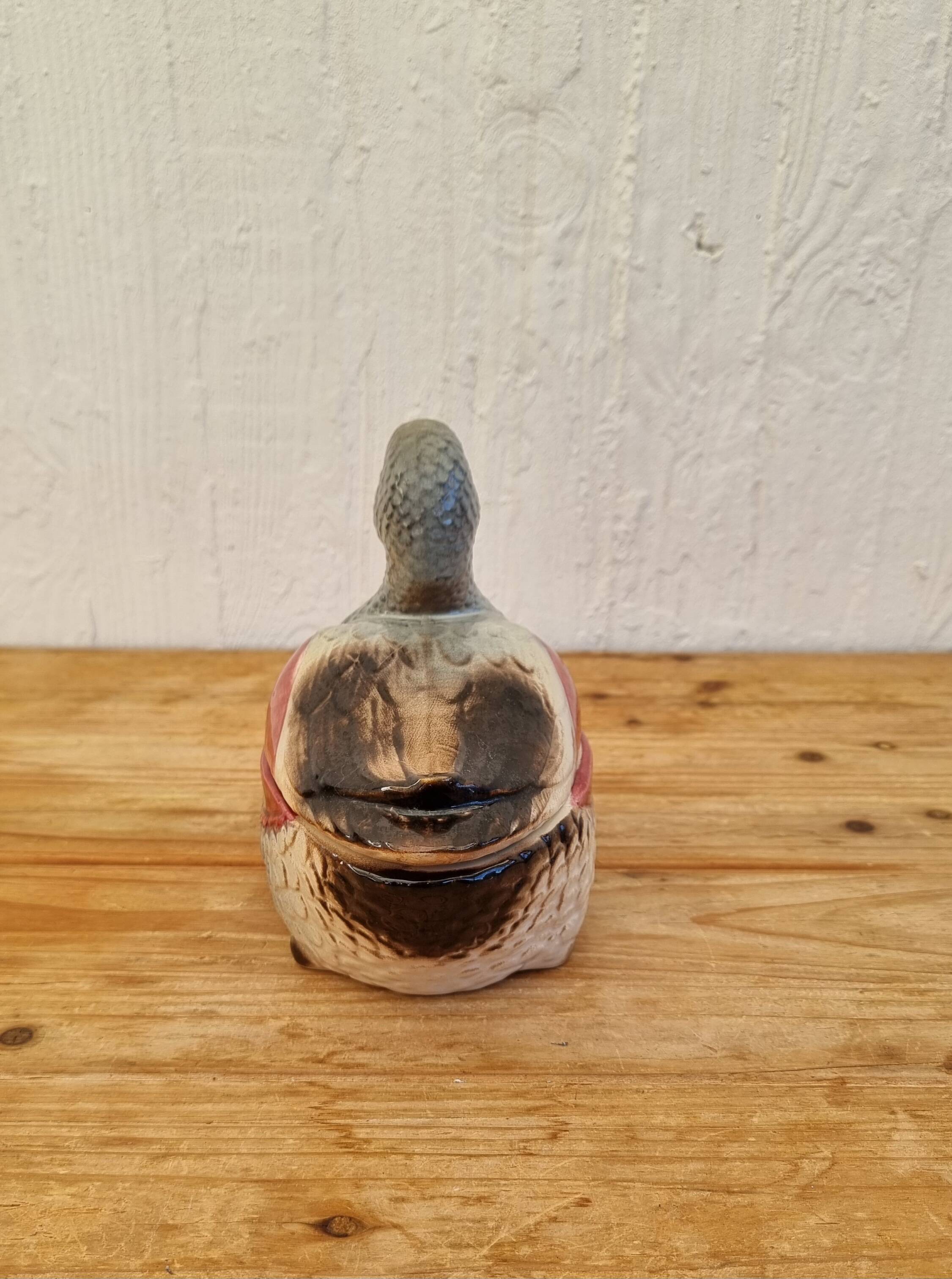 Antique earthenware terrine in the shape of a duck.