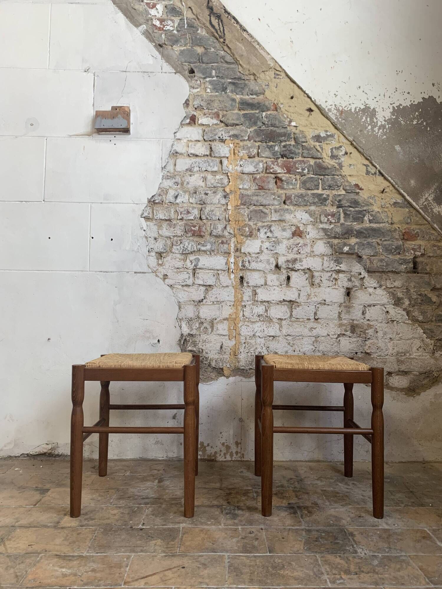 Pair of 20th century wooden stools with straw seats