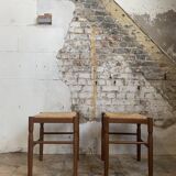 Pair of 20th century wooden stools with straw seats