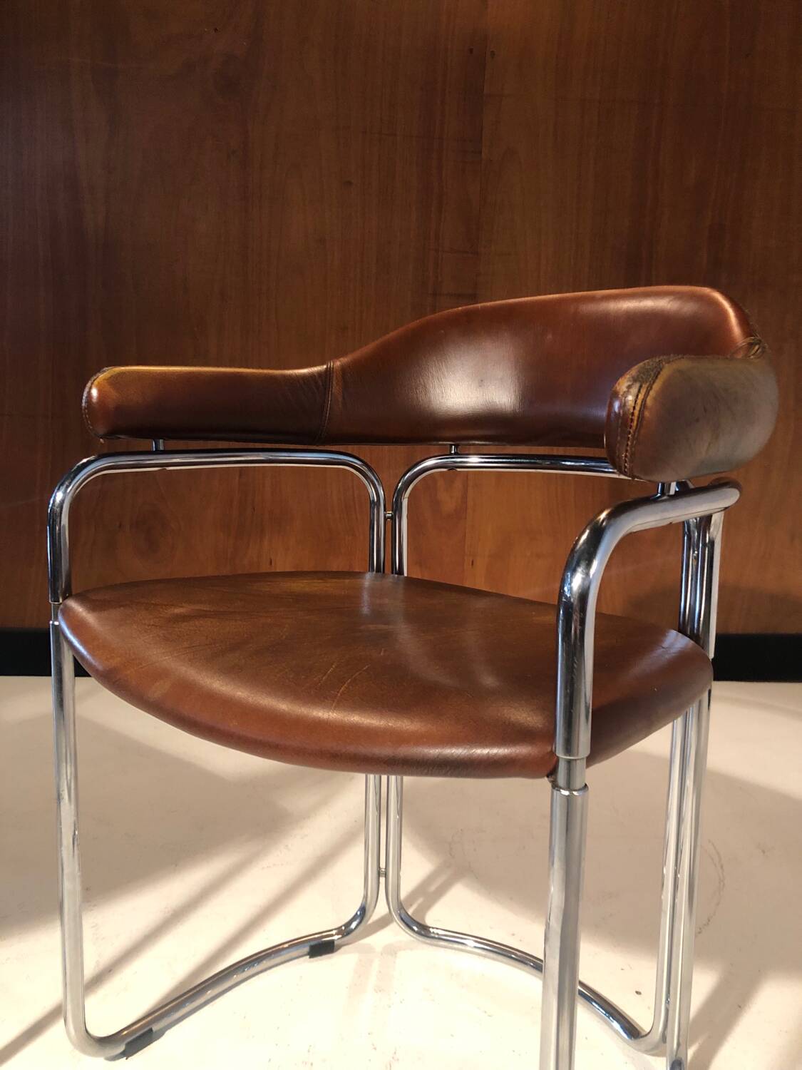 Pair of vintage armchairs, cognac leather and chrome steel 1970
