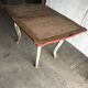 Rustic red and cream wooden dining table, moulded top, 1950s.