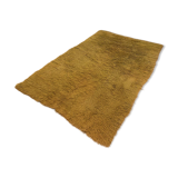 Large handmade wool rug from the 70s in lime green.