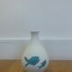 White ceramic with dolphin motif