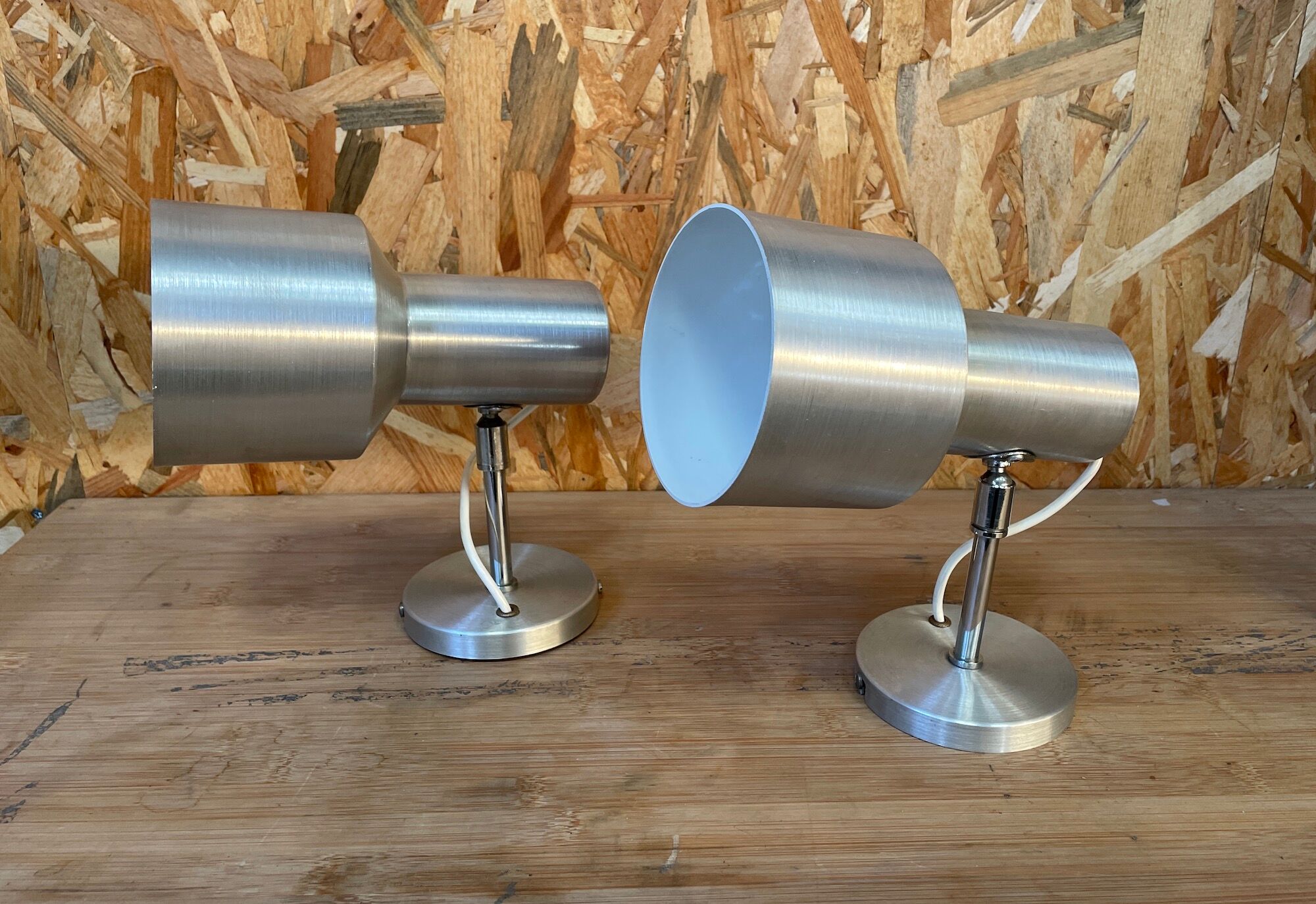 Pair of swivel brushed metal sconces