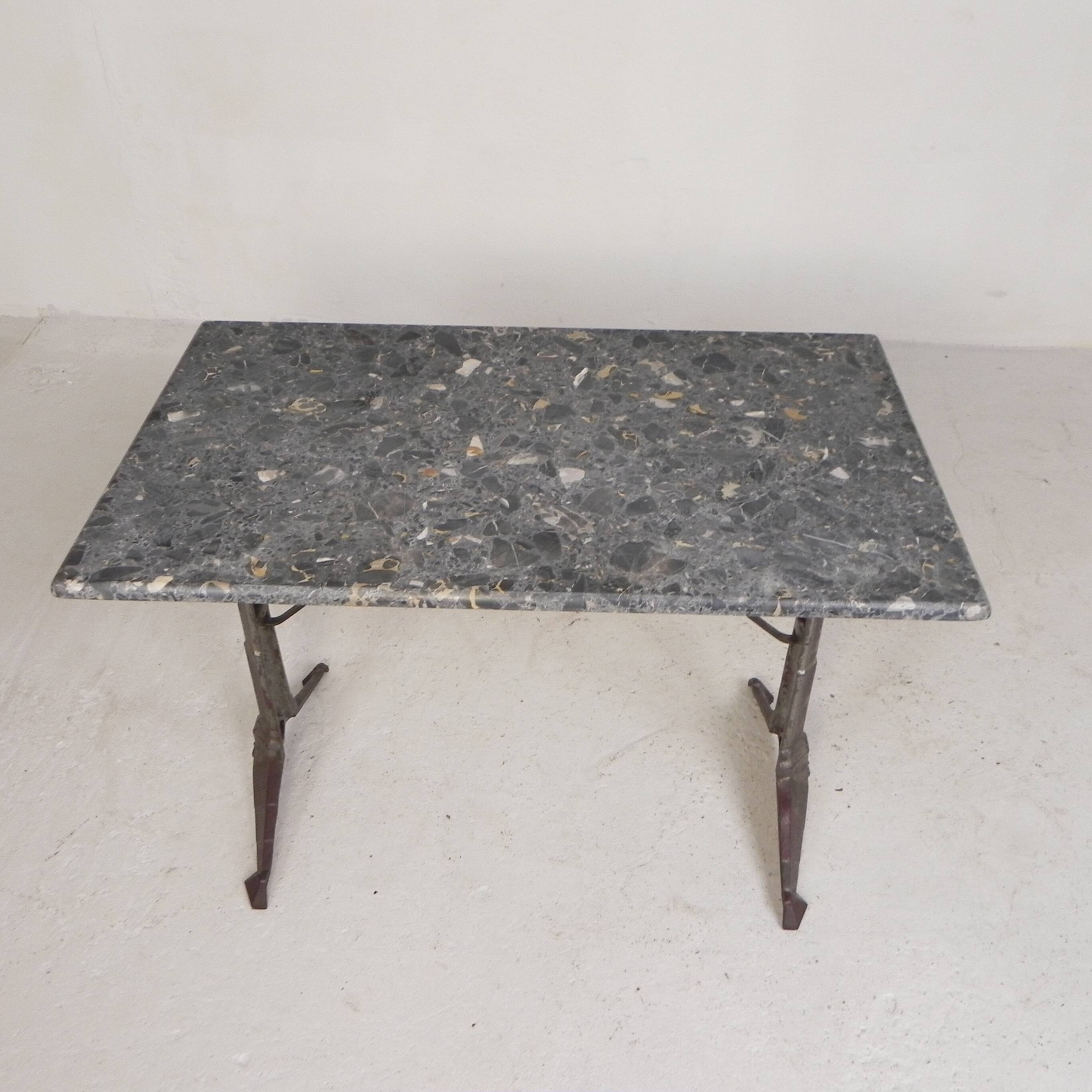Bistro table with a marble top on a cast iron frame, 1930s.
