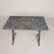 Bistro table with a marble top on a cast iron frame, 1930s.