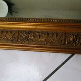 Mirror with gilded wood and stucco frame, early 20th century, 59x83cm