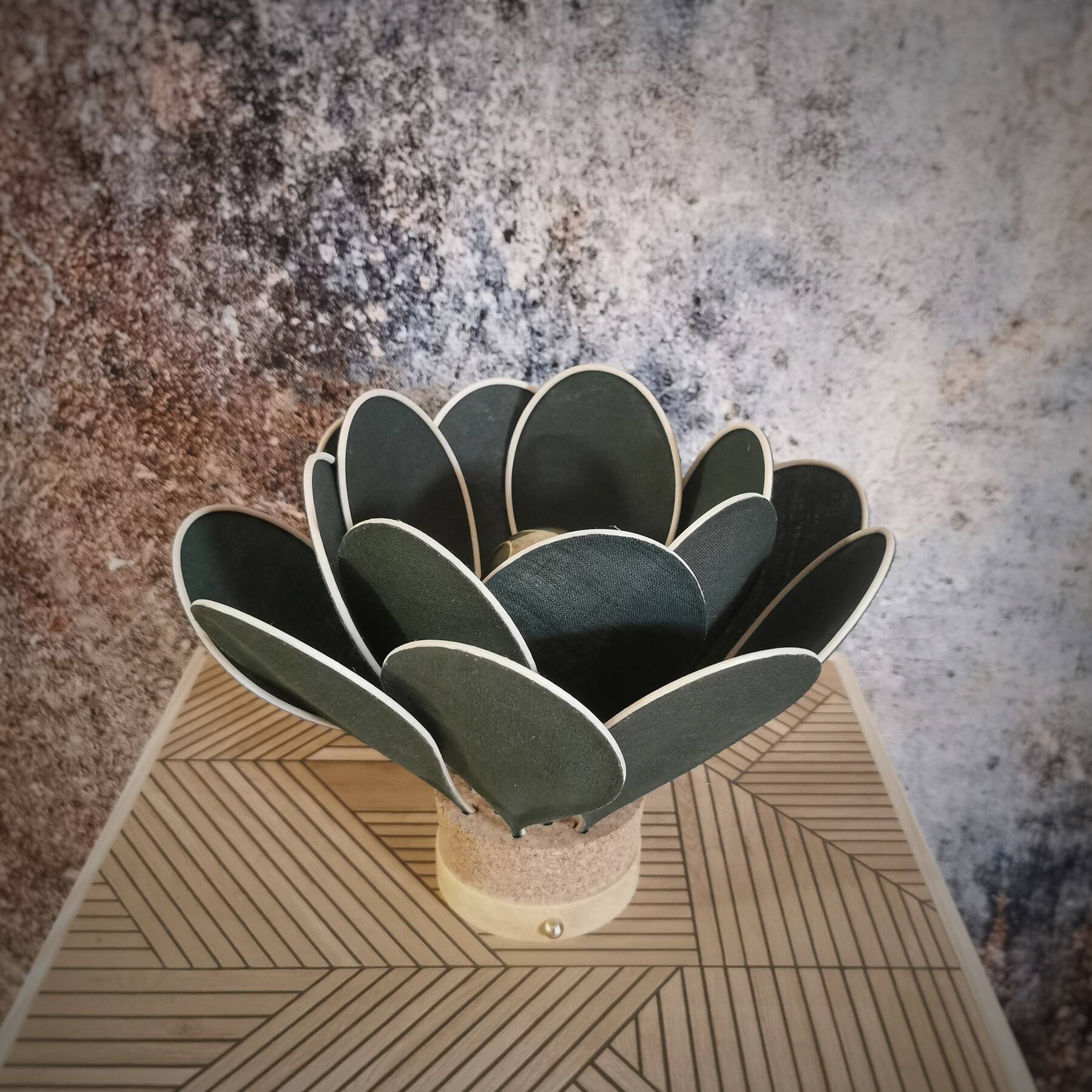 Flower table lamp made of rattan and fir green linen petals