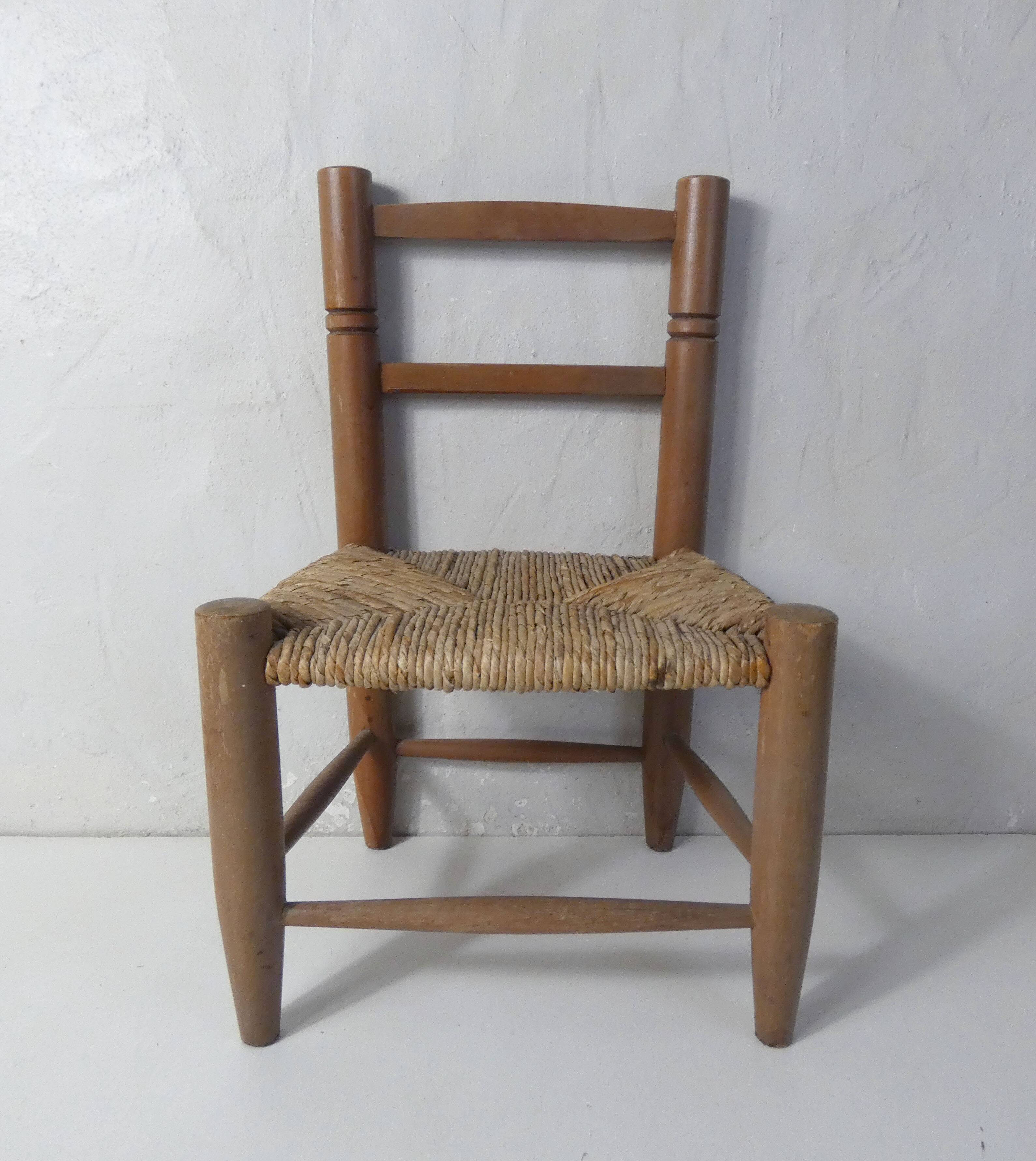 Old wooden straw chair for children