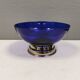 Beautiful blue glass bowl mounted on silver colored base (Original).