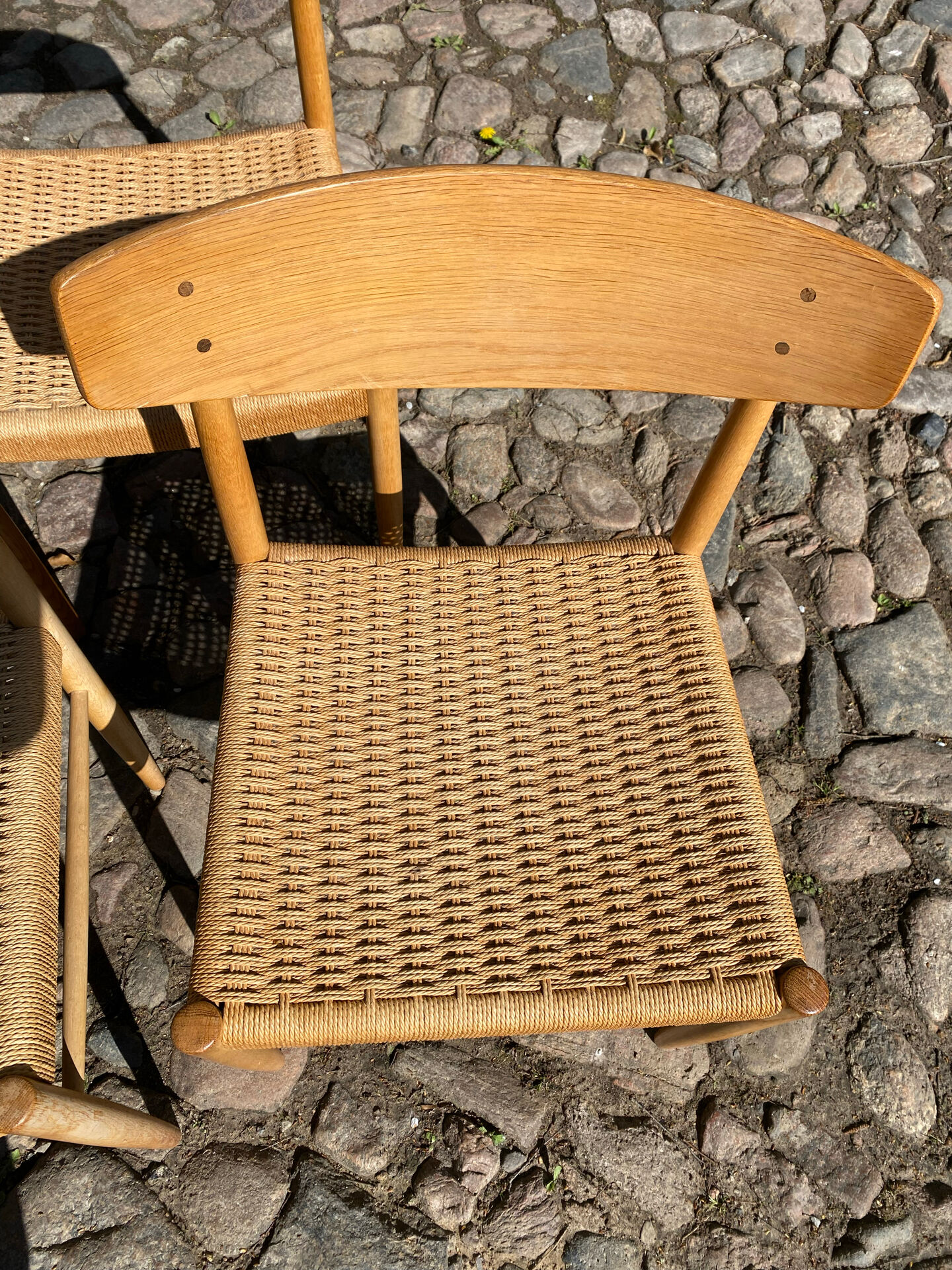 8 dining chairs in oak  w/ paper cord