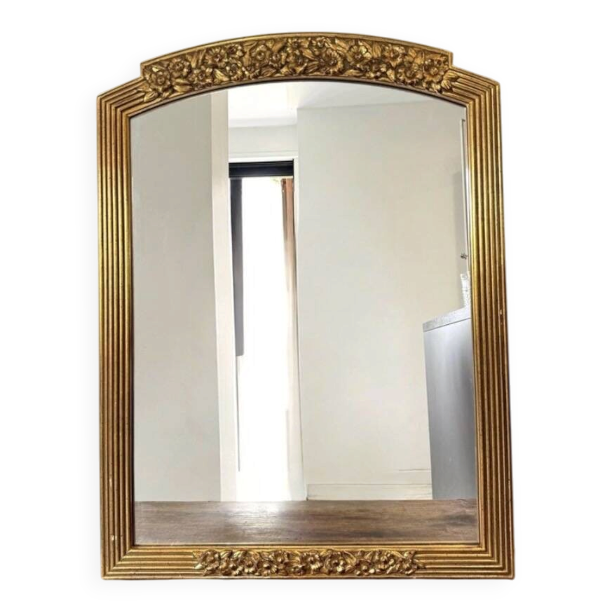 Large vintage gold mirror in Louis XVI style – fluted frame and floral decoration.