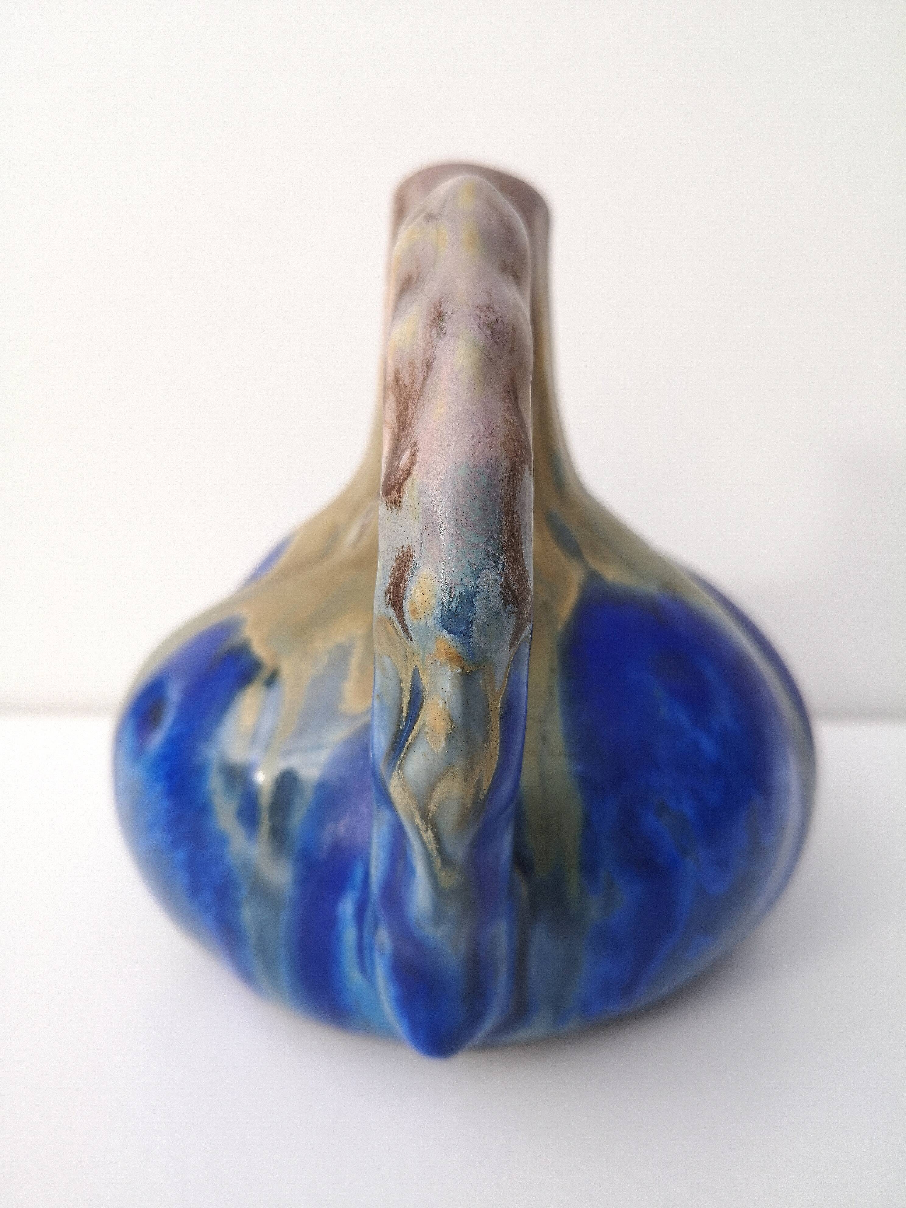 Vintage decanter in enamelled earthenware