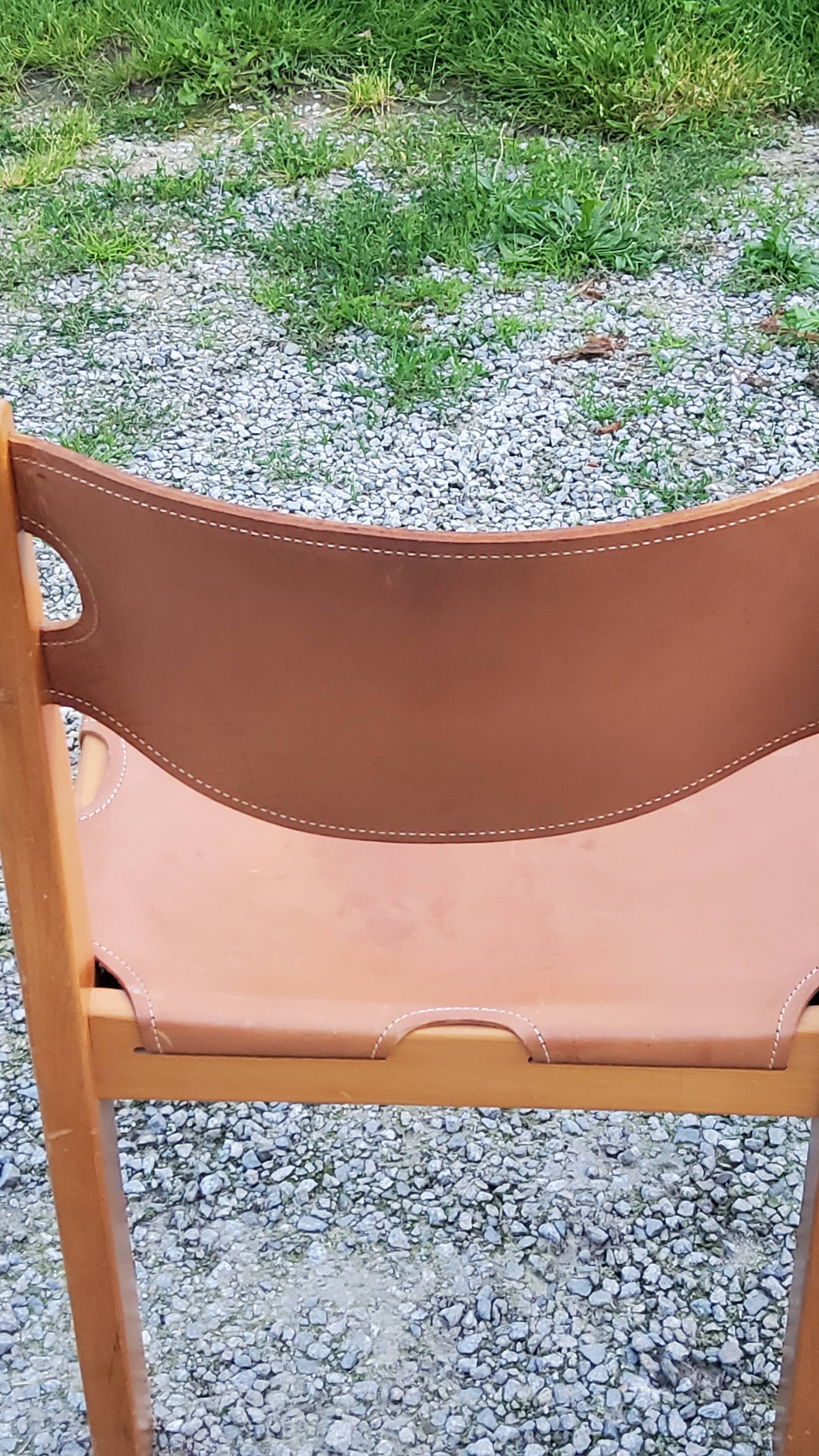 Pair of brutalist chairs in elm and stretched leather with saddle stitching Self publisher