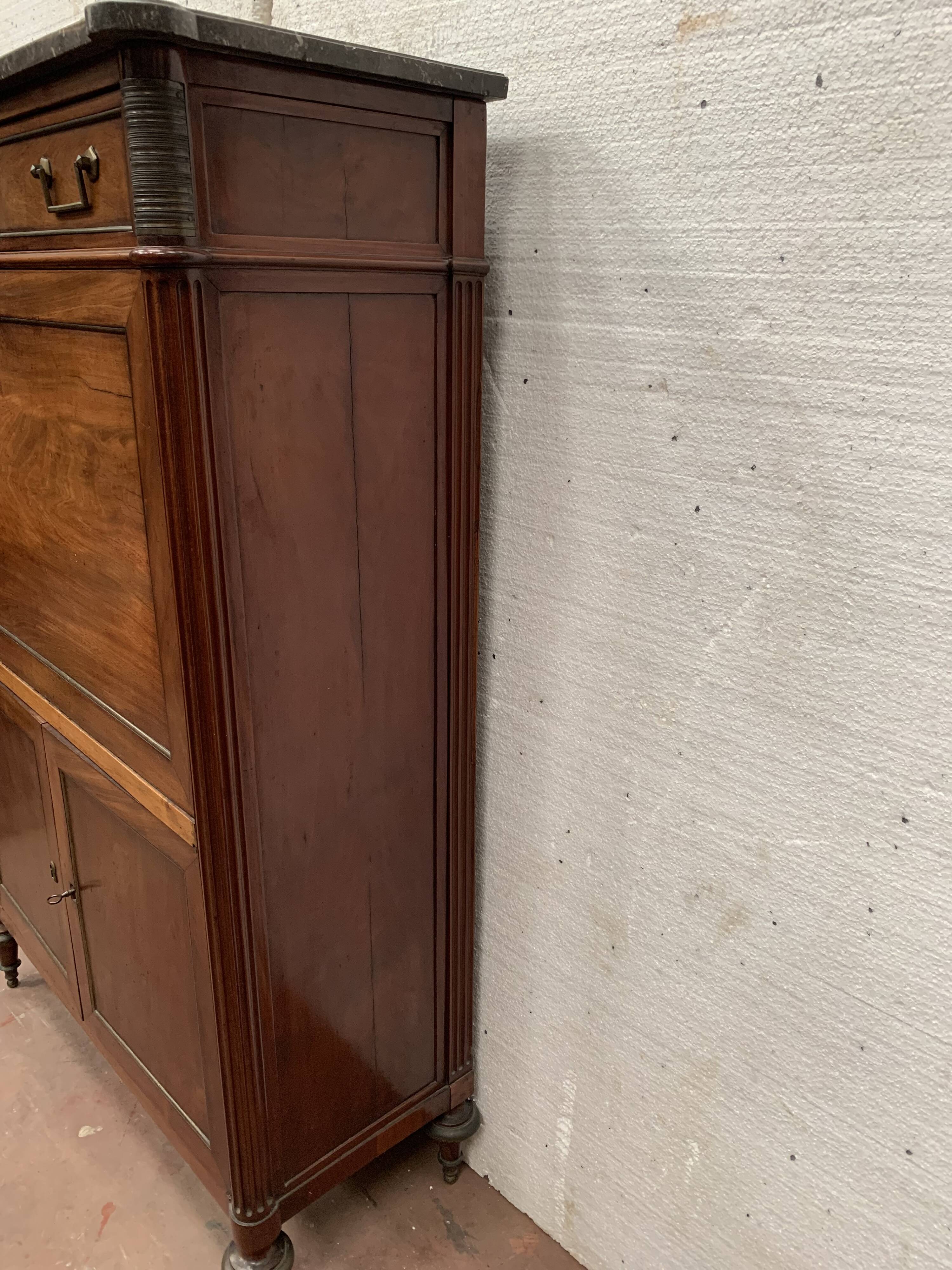 Secretary Louis XVI in mahogany Top of veined gray marble XIX century