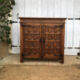 Spanish furniture with carved wood profiles and coats of arms from the 1950s.