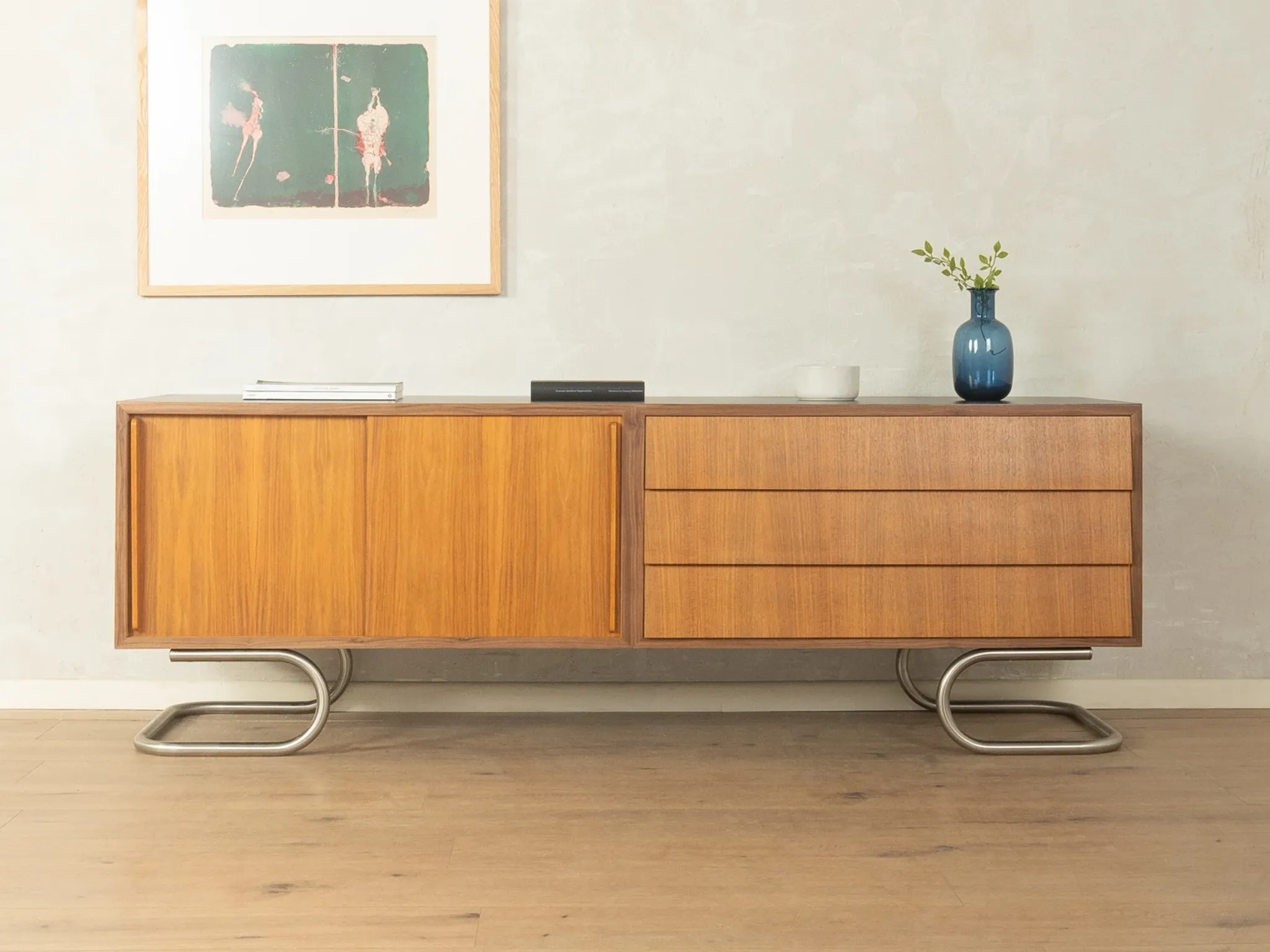 Striking mid-century sideboard with stainless steel base