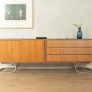 Striking mid-century sideboard with stainless steel base
