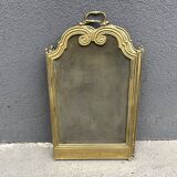 Antique brass fireplace screen from 1920, vintage spark guard.