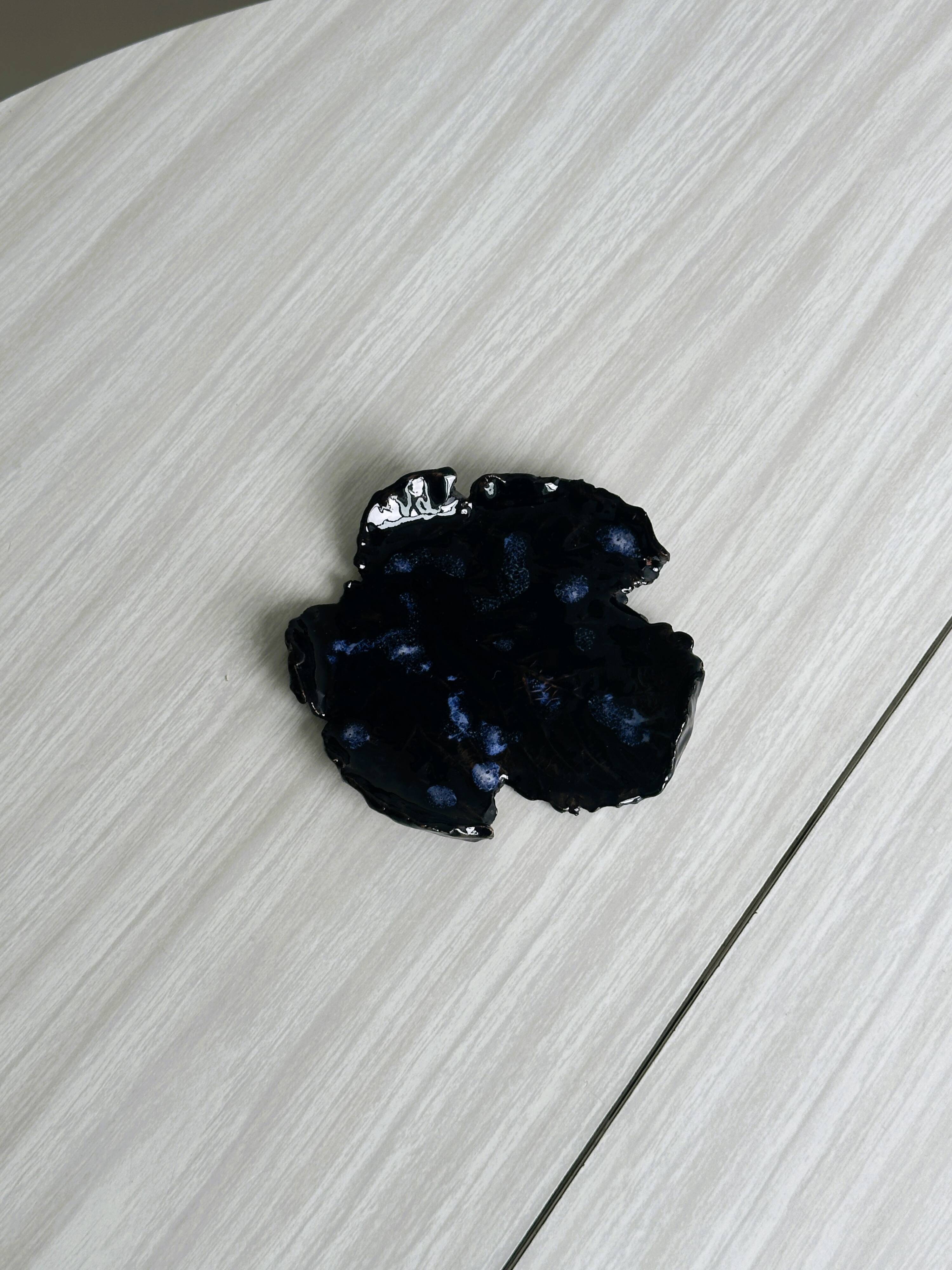 Handcrafted enameled black ceramic pocket emptier