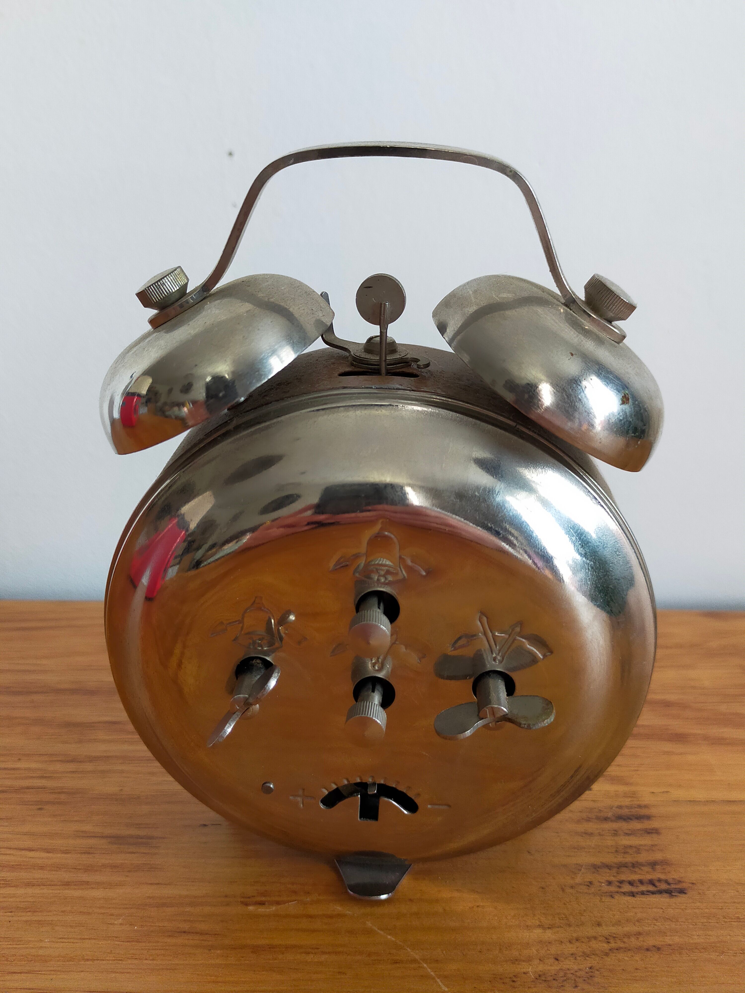 Vintage brown and silver mechanical alarm clock