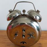 Vintage brown and silver mechanical alarm clock