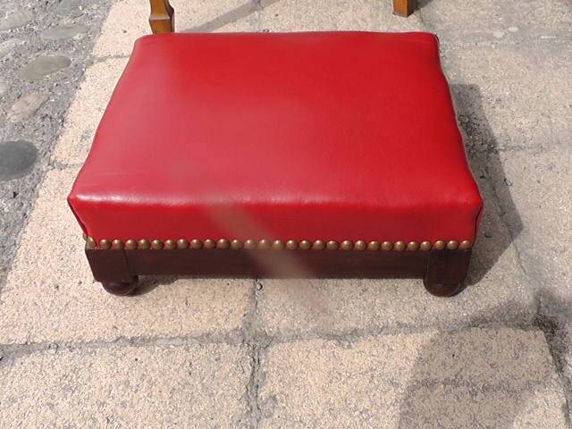 Red leather armchair and footrest