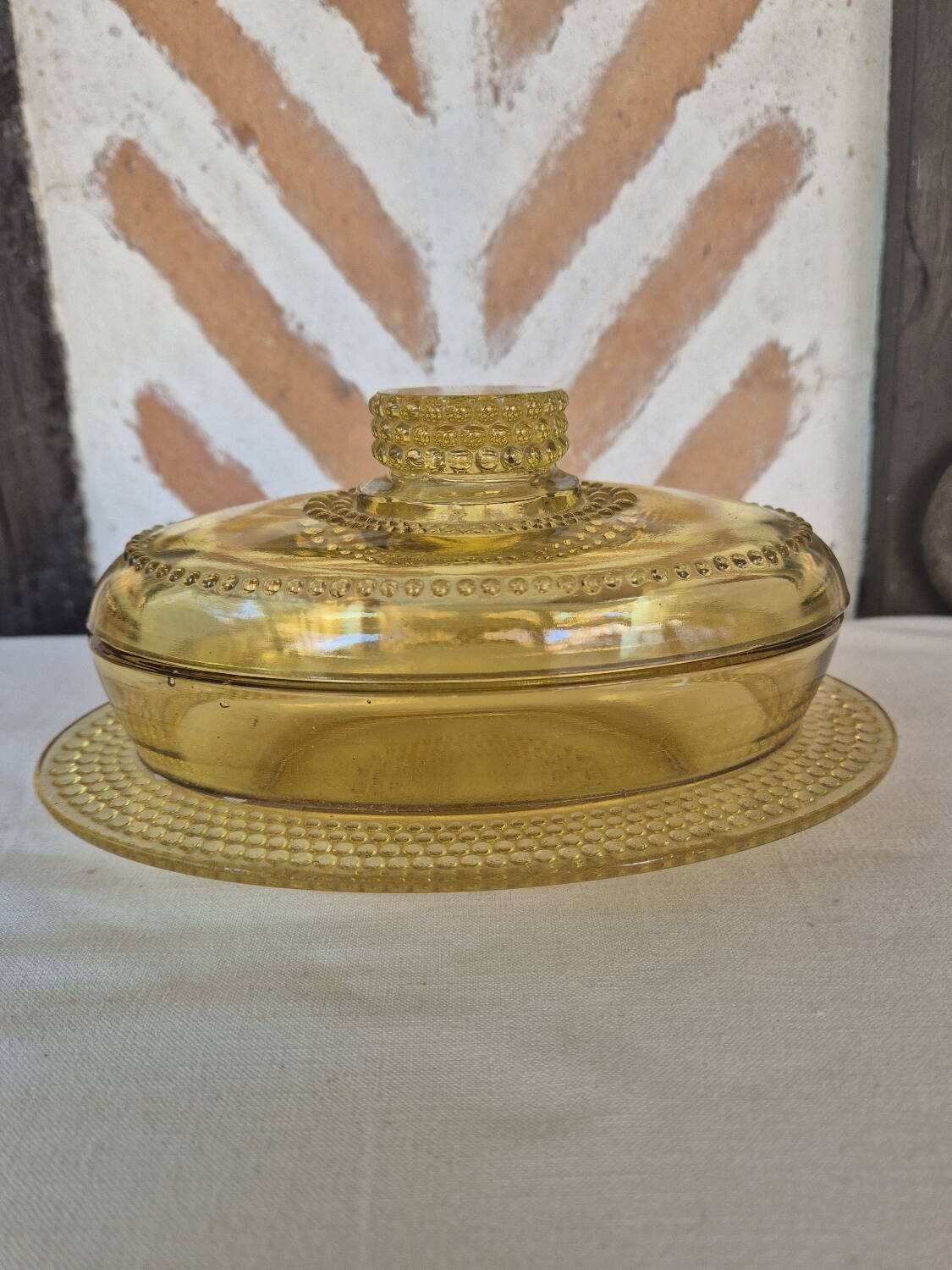 Amber glass butter dish, 1940