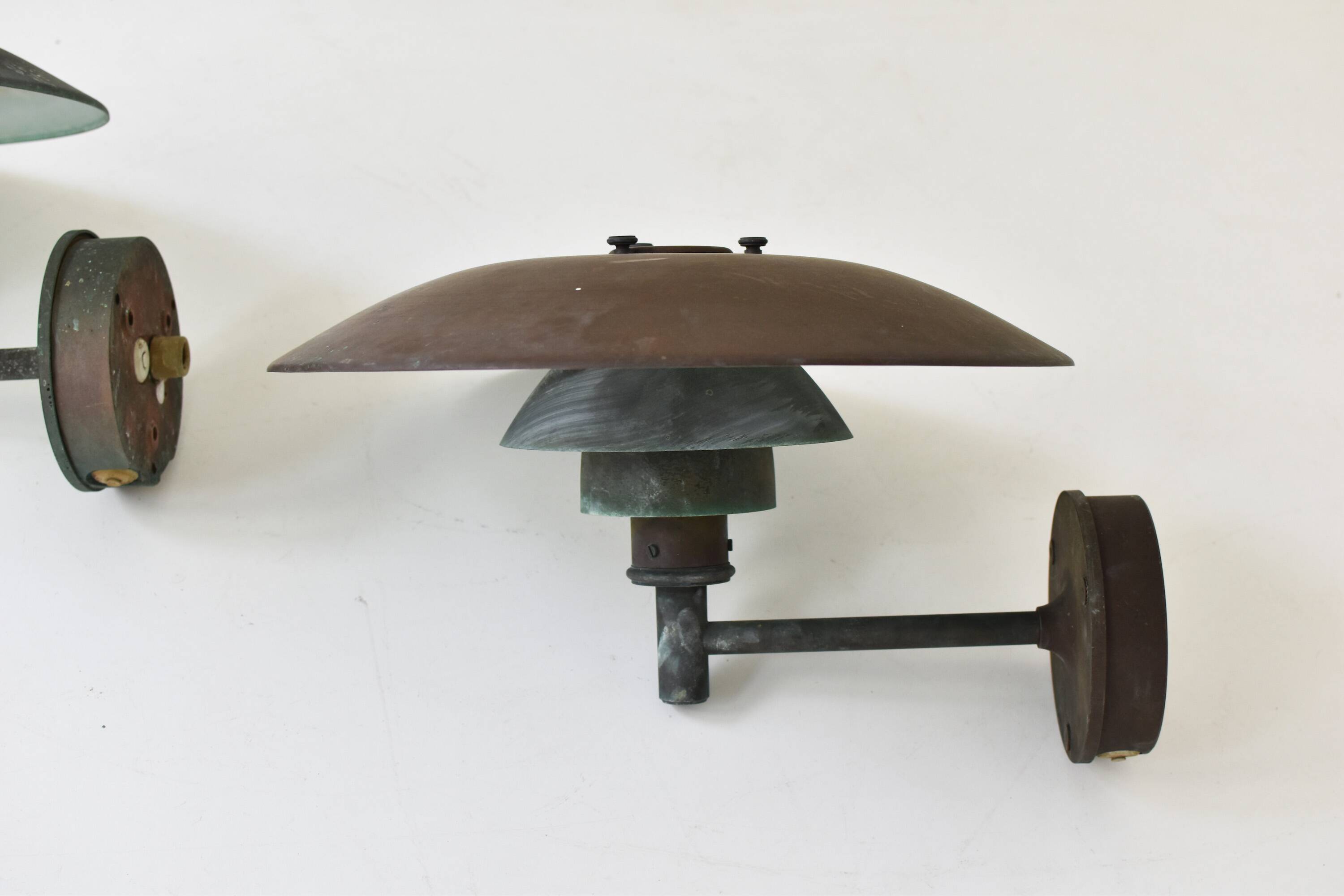 A set of two ph 4.5 copper wall lamps by poul henningsen for louis poulsen, denmark 1980s.