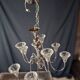 Chandelier from the 1930s to 1950s in chrome metal and thick glass.
