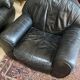 Pair of black leather club armchairs, twentieth century