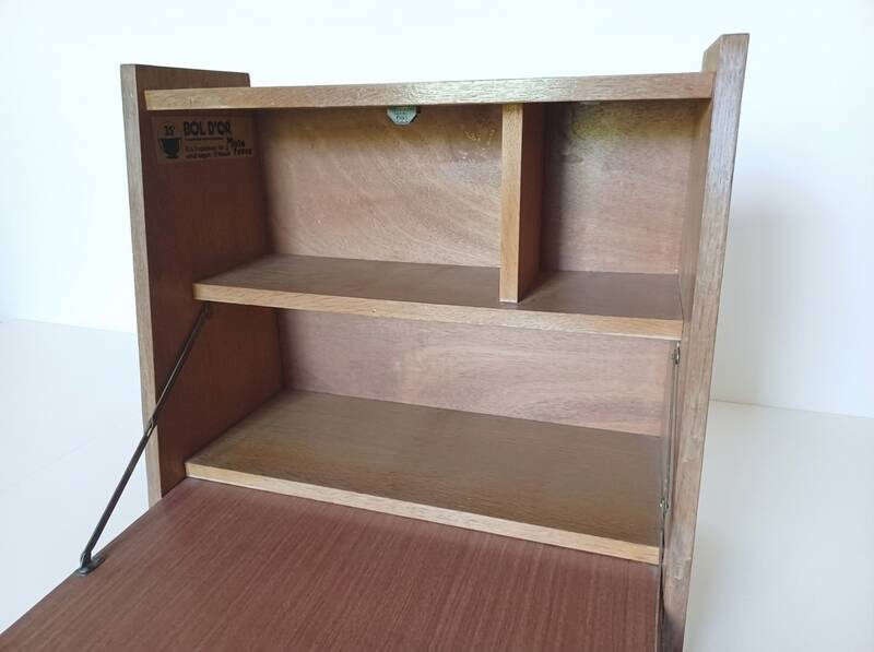 Vintage 1960s secretary desk with an angled design, light wood, and tapered legs.