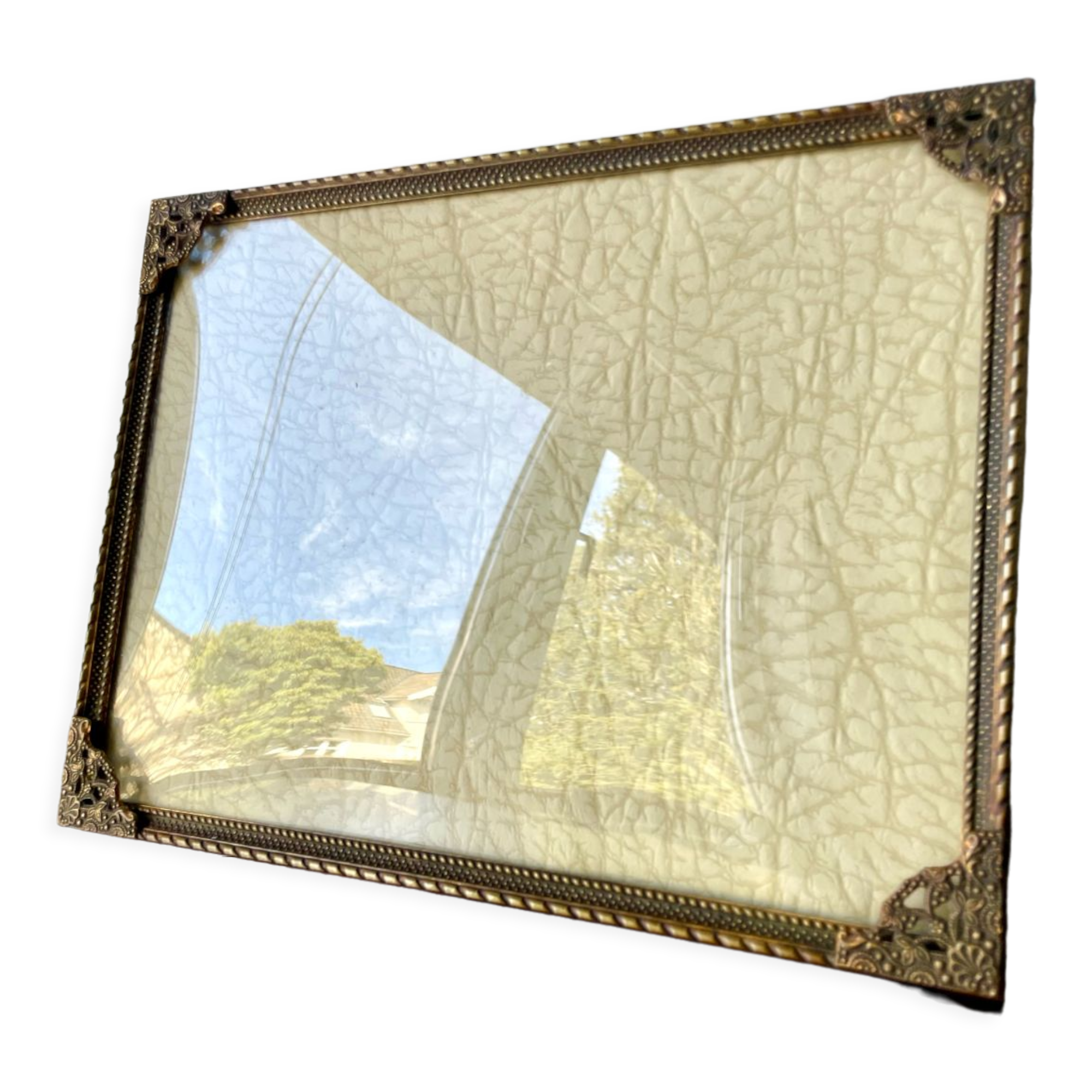 Metal frame in gold colored brass