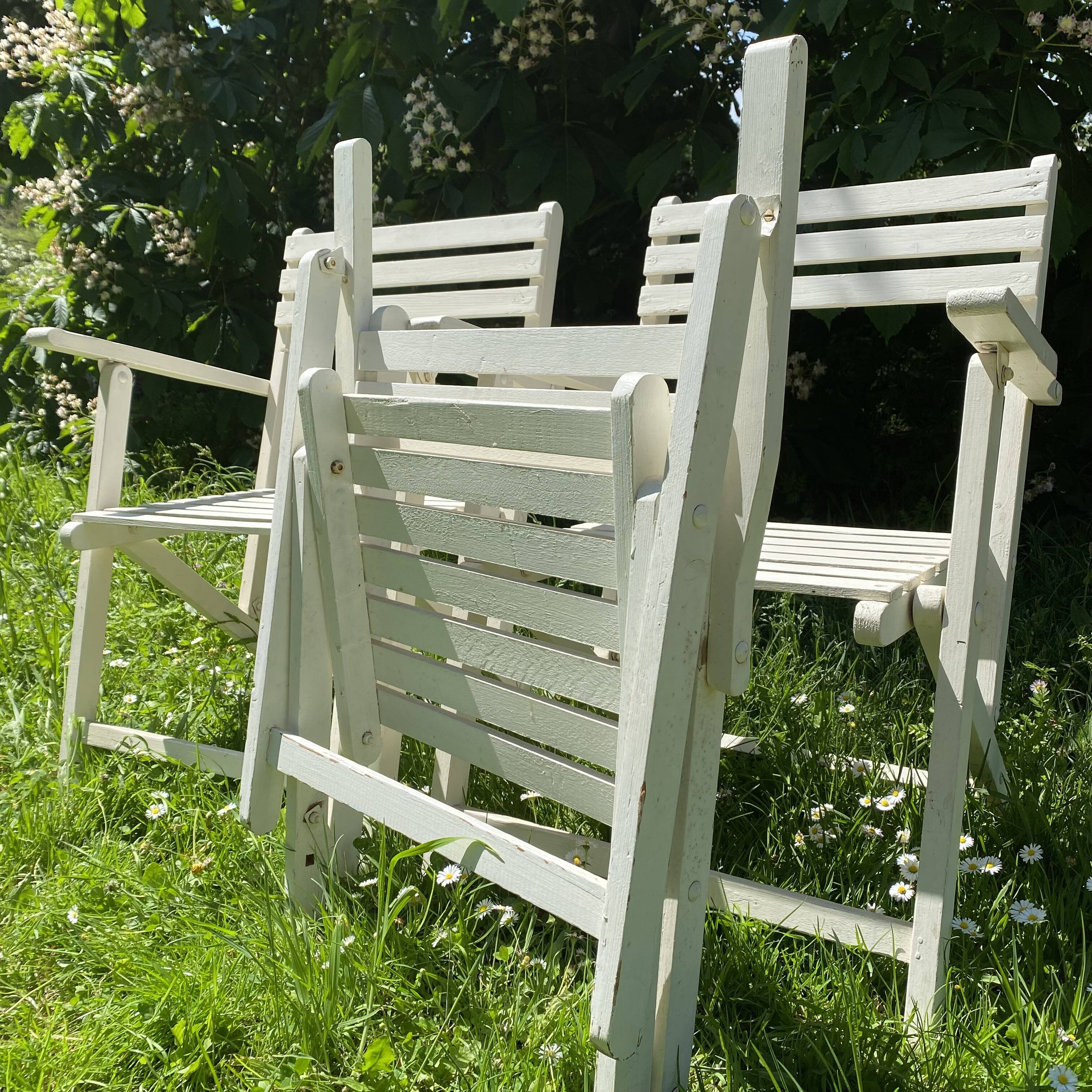 Folding slatted garden armchairs