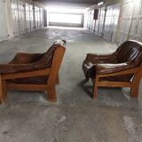 Armchairs in leather and vintage wood 70's