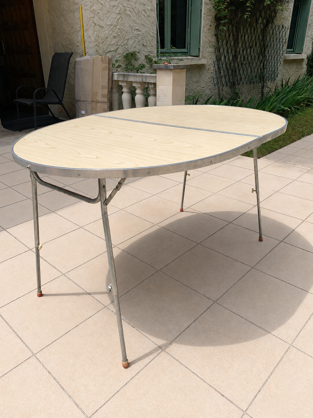 Folding oval table - height adjustable - metal and laminate - 60s/70s.