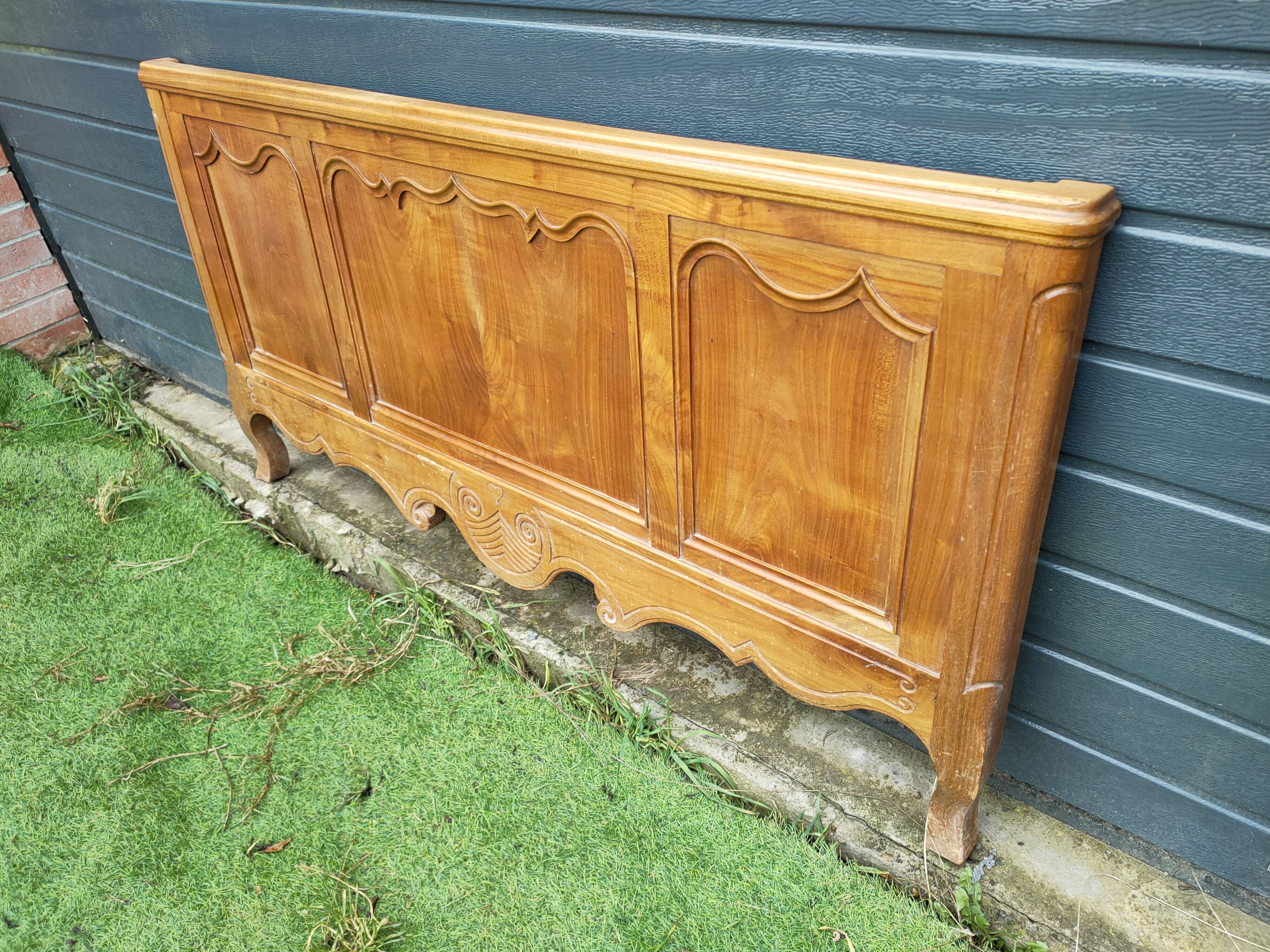 antique headboard in cherry wood