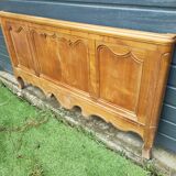 antique headboard in cherry wood