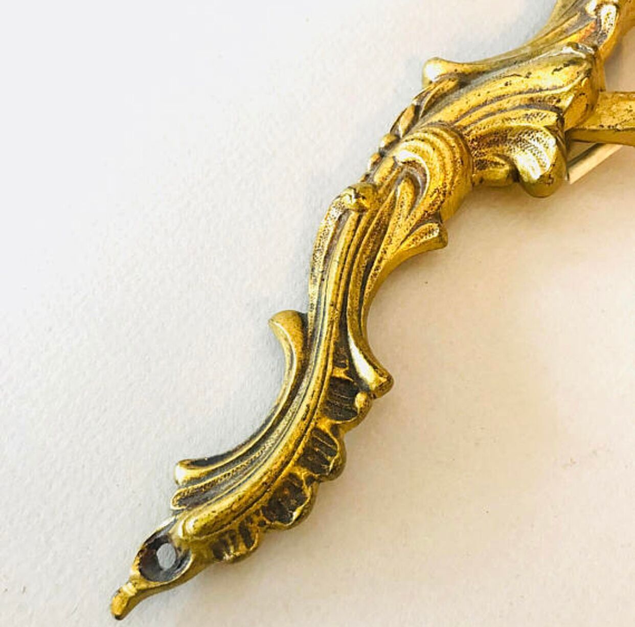 A pair of rococo gilded wall lights