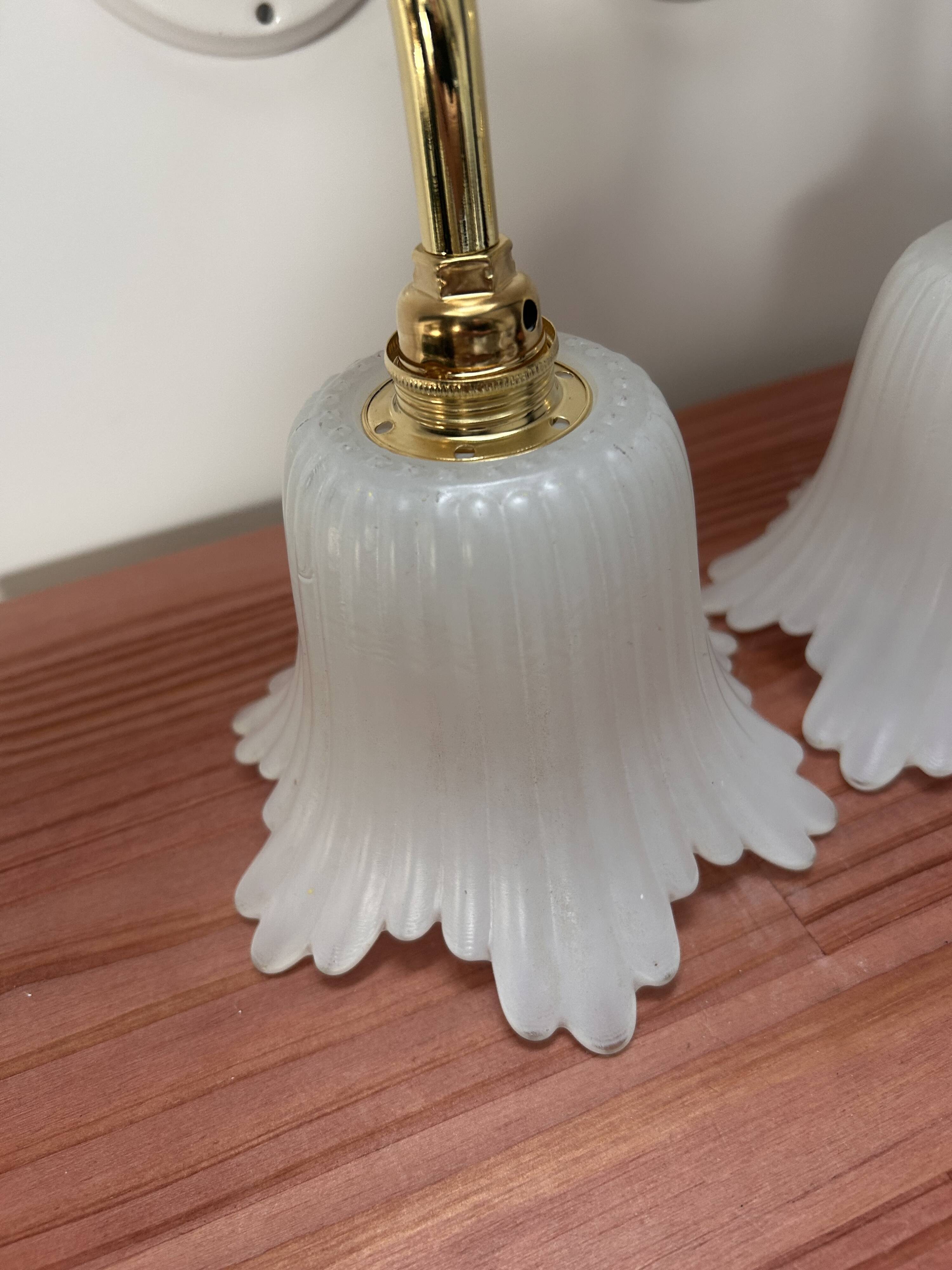 Pair of white tulip wall sconces