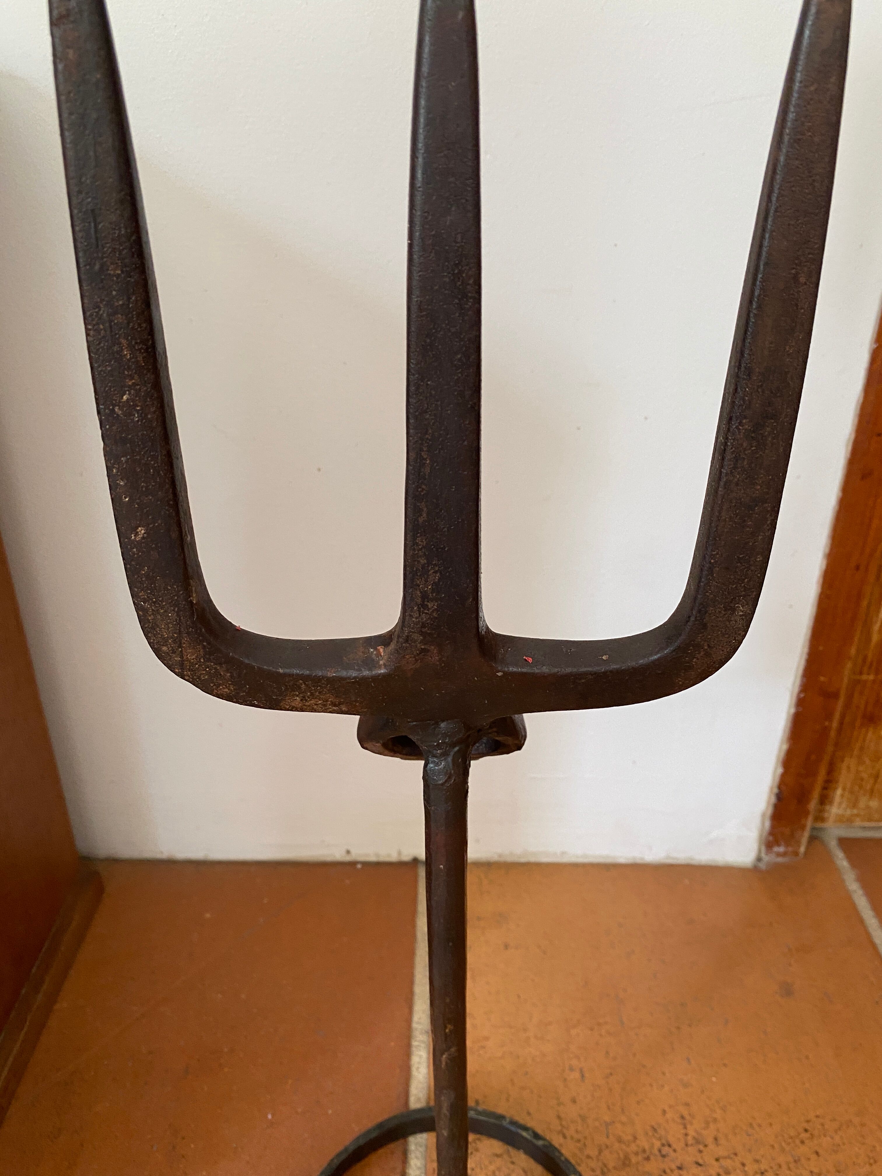 Brutalist iron candlestick on a stand
