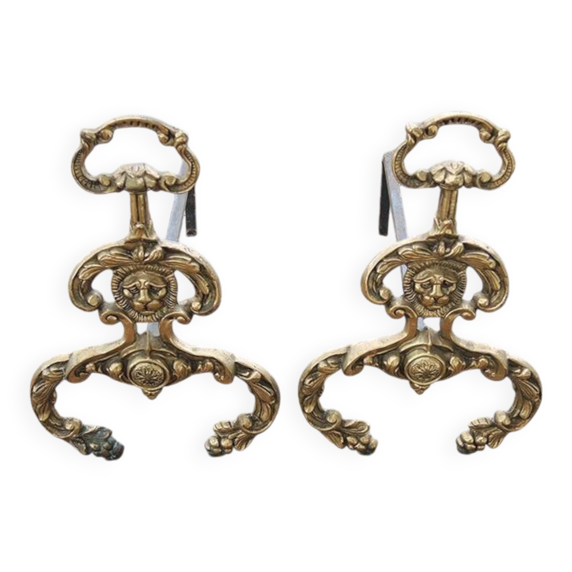 Antique brass andirons with lion decoration