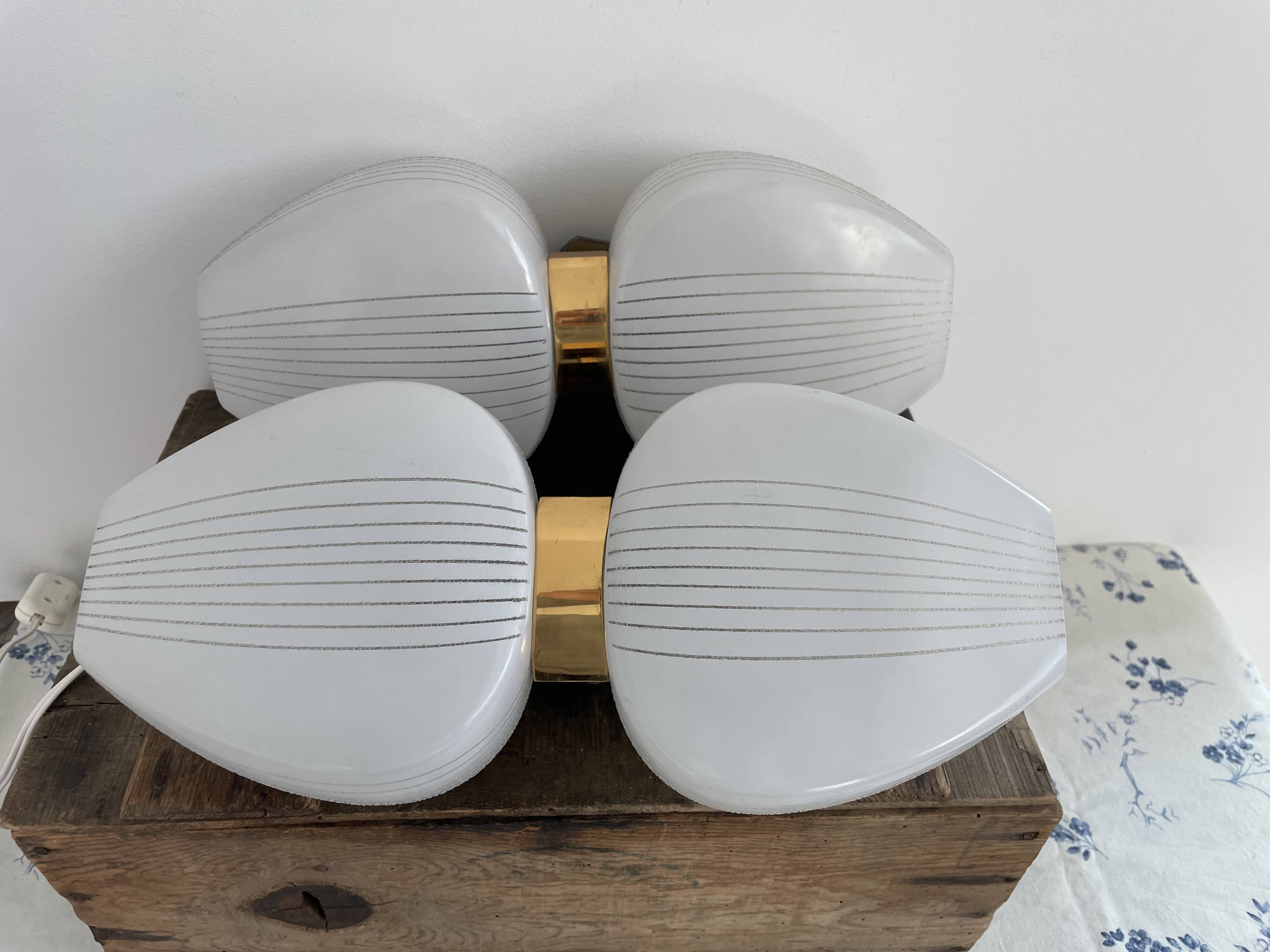 Pair of vintage wall lights from the 60s-70s in striped opaline glass and gilded brass.