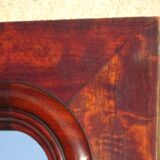 Large antique mirror in a flame mahogany frame; 132x82 cm