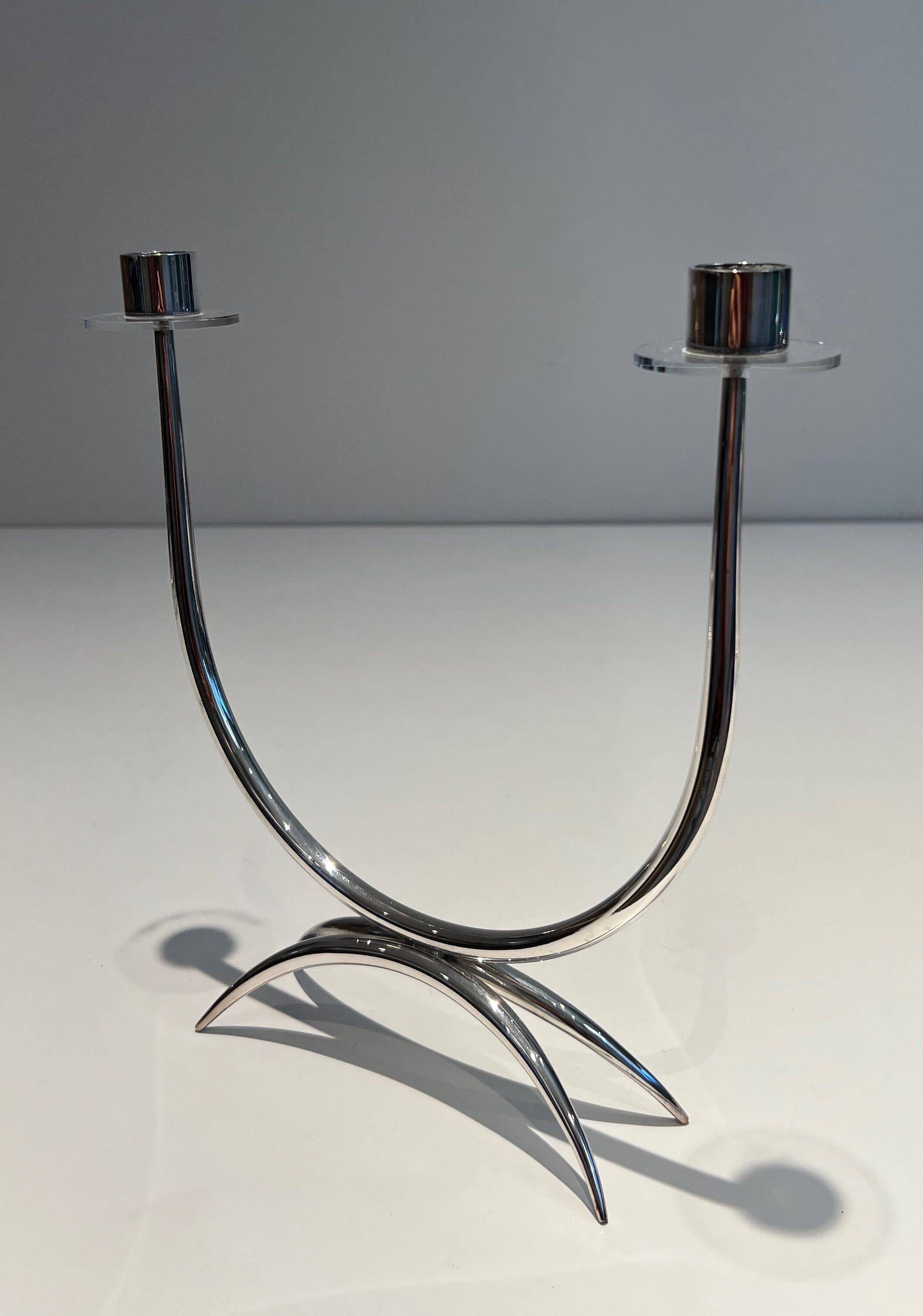Silver-plated metal and plexiglass design candlestick.