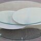 Coffee table with rotating glass tops by Antoine Motard.